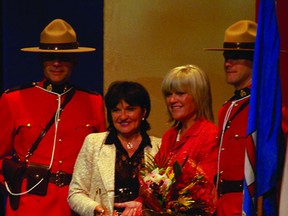 Mayor Linda Osinchuk presents the Mayor’s Award to last year’s recipient, former MLA Iris Evans (right). File Photo