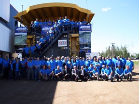 Members of SMS Equipment and MacDonald Island Park were on hand to announce a partnership between the two, giving naming rights to the industrial company for the SMS Stadium at Shell Place, which is set to open in July 2015. The announcement was made Thursday afternoon at SMS Equipment atop a 15.5 metre long Komatsu 930E haul truck. AMANDA RICHARDSON/TODAY STAFF