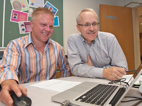 James Nagle (left), chief operating officer at Brantford Hydro, and Andy Molenaar, vice-chair of economic development, take part in a Smart City workshop Thursday at Nipissing University. (BRIAN THOMPSON, The Expositor)
