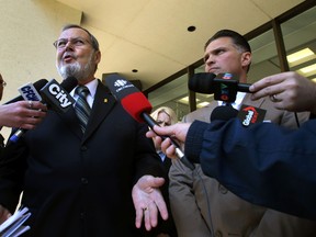MP Peter Goldring (l) and his lawyer Dino Bottos speaks to the media outside the downtown courthouse in Edmonton, Alberta on Thursday, June 6 , 2013.  Goldring was acquitted of refusing to blow during a traffic stop.  Perry Mah/Edmonton Sun/QMIAgency