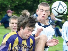 St. Michael Warriors' Derek Van De Walle, right, and Kingsville District's Brian Whaley contend for the ball during boys AA OFSAA soccer action at St. Michael Thursday. Warriors won 2-0. (SCOTT WISHART The Beacon Herald)