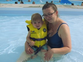 Tara Arsenault and her son Theo Arsenault, 14 months, of Mayerthorpe get cool in the Mayerthorpe outdoor swimming pool at about 6 p.m. on Thursday, June 6. The pool opened this week and a signup for lessons was scheduled at the Community Services Building on the evening of Thursday, June 6. For June there is school rental, public swim time, family swim time and lane swim time offered.