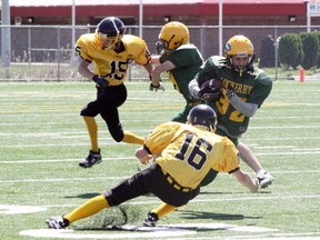 Lockerby Vikings' Shane Wilkinson (32) avoids a tackle attempt by Lively Hawks' Carson Dewar (16) during junior high school football action at James Jerome Sports Complex on Thursday. Ben Leeson/The Sudbury Star/QMI Agency