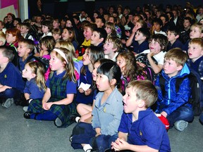 Students at Academie catholique Ange-Gabriel react Thursday to watching a video of Montreal where, minutes later, 20 students found out they would be going for a wrap up of the Get up and Move! challenge. (DARCY CHEEK The Recorder and Times)