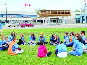 Members of the orange team play a rousing game of Bishop, Bishop, Falcon, which is more commonly known as duck, duck, goose, as part of the Amazing Race Day at Bishop Smith, which served as an orientation for Grade 7 going to the school in September.