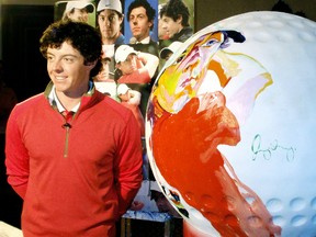 PGA defending champion Rory McIllroy poses beside a huge, plastic golf ball that features an artist's painting of his face during this week's media event at Oak Hill Golf Course in Rochester, New York, which was attended by Chatham Daily News travel and business writer Bob Boughner. BOB BOUGHNER/ THE CHATHAM DAILY NEWS/ QMI AGENCY