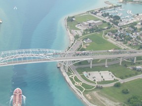 Aerial view of a ship passing underneath the Bluewater Bridge on June 6 in Sarnia, Ont. LIZ BERNIER/ THE OBSERVER/ QMI AGENCY