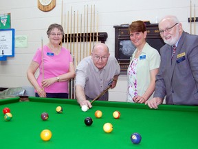 The Tillsonburg Senior Centre recently received a $500 grant from the Oxford Community Foundation to refurbish a heritage pool table that once belonged to the Tillson family. At the grant announcement Tuesday morning were, from left: Barb Libon, co-treasurer; Gerry Carter, president; Nancy Boutin, manager; and Keith Hudson, executive director of the Oxford Community Foundation. KRISTINE JEAN/TILLSONBURG NEWS/QMI AGENCY