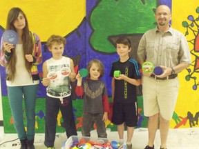 Pictured in front of their newly painted mural from left to right are: Grade 8 student, Aanzhenii John, Grade 2 student Ian Matheson, Junior Kindergarten student Finn Cox, Grade 4 student Darin Shular and GC Huston principal Dan Russell.