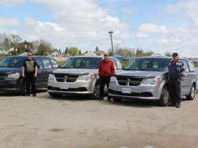 David Oldfield, Brian Hofferd and Joe Chapleau PT Taxi drivers standing with the three new vans recently purchased by the company.