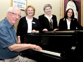 Members of the Brockville Concert Association board pose by the 1927 Steinway piano at the Brockville Arts Centre lobby. From left are Alan Ogborne, president Anne Dawson, Marie-Helene Bouillot, and Samia O'Day. RONALD ZAJAC The Recorder and Times