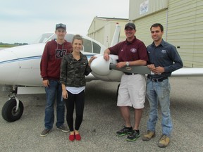 Bailey and Brittany Nethercott, Jason Brent and Gary Ryan pose with one of the planes in Huron Flight Centre's fleet on Thursday in Sarnia. LIZ BERNIER/ THE OBSERVER/ QMI AGENCY