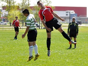 Ontario Federation of School Athletic Associations Boy's ‘A’ Soccer Championship host O’ Gorman Knights failed to make the knockout stage of the tournament on Friday because of their record. The Knights were hoping the Walkerton Riverhawks would beat the Glengarry Gaels earlier in the day, but that didn't happen. The Knights played their fourth and final game Friday afternoon against the  Ecole Secondaire Catholique Renaissance side, eventually losing 3-1. Knights’ midfielder Donovan Fuller, left, goes up for a header with Renaissance midfielder Adam Hemati.