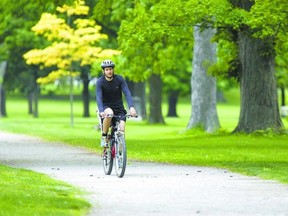 Eric Siemens rides his bike in Springbank Park Friday in London. He rode from his St. Thomas home to enjoy the park. Cyclists can participate this month in a two-week bike festival promoting safe cycling for youngsters and others who?ve not ridden on the road. (DEREK RUTTAN, The London Free Press)