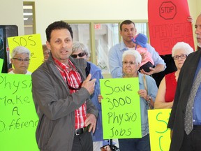 Timmins physiotherapist Louis Favretto, left, and MPP Gilles Bisson (NDP–Timmins-James Bay) were joined by a group of protestors on Friday to challenge the Ontario government to re-consider changes to how it offers physiotherapy in retirement residences and seniors' homes.