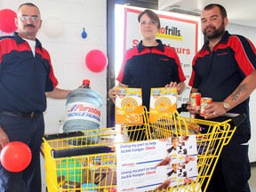 Cory Laface, right, was joined by Purolator colleagues Vic Boucher, left, and Stacey Palmer on Friday as they attempted to Tackle Hunger at No Frills in benefit of the South Porcupine Food Bank. Laface knows first-hand how important food banks can be for struggling families. As a boy, Laface and his parents called upon their local food bank more than once to guide them through tough times.