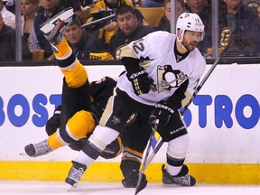 Penguins forward Jarome Iginla checks Bruins defenceman Johnny Boychuk during Game 4 of the NHL Eastern Conference final at TD Garden in Boston, June 7, 2013. (JESSICA RINALDI/Reuters)