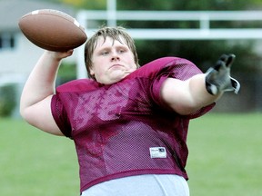 Chatham-Kent Cougars lineman Kameron Rylett-Ward throws on the sideline during Thursday's practice at the Chatham-Kent Community Athletic Complex. (MARK MALONE/The Daily News)