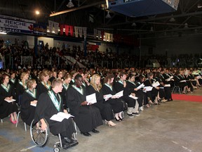 Photo credit: STEPHEN UHLER stephen.uhler@sunmedia.ca
Some of the 400 members of the Class of 2013 listen to the opening addresses during Algonquin College in the Ottawa Valley's 43rd convocation ceremony, held Thursday night at the Pembroke Memorial Centre. They have the distinction of being the first graduating class from the new waterfront campus. For more community photos, please visit our website photo gallery at www.thedailyobserver.ca.