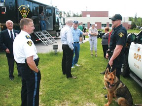 Kenora detachment OPP Staff Sgt. Paul van Belleghem converses with K-9 unit Const. Chris Halverson about his working dog Diesel during OPP Veteran’s Day activities at the Hwy. 17 detachment, Thursday, June 6.
REG CLAYTON/Daily Miner and News