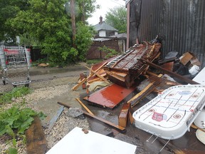 Garbage and other items left piled in lanes, as seen on Selkirk Avenue near Salter Street on May 31, 2013, can often lead to arsons. A city report says the number of arsons has more than doubled in the past six years while arrests have dwindled. KEVIN KING/Winnipeg Sun/QMI Agency