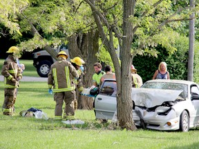 A male driver and his female passenger were taken to hospital with non-life threatening injuries after their car hit a tree on Grande River Line on Saturday evening. TREVOR TERFLOTH / CHATHAM DAILY NEWS / QMI AGENCY
