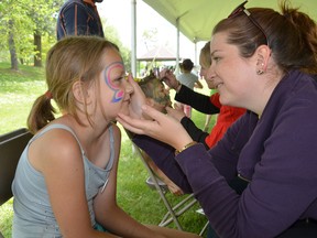 Amy Ritchie, 8, of Owen Sound has a butterfly painted on her face by Keystone therapist and fun festival volunteer Diane Liska at the fifth annual Keystone Family Fun Festival at Kelso Beach Park in Owen Sound on Saturday. A record crowd of about 2,500 people attended the event, which offered free family events. (Rob Gowan The Sun Times)