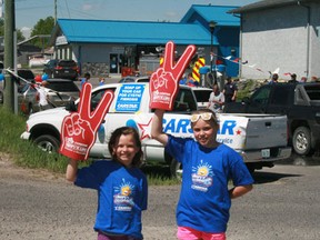 CarStar kids Taylor Henley, 8, and Lee Derksen wave motorists into the 10th Annual Soap it Up for Cystic Fibrosis charity car wash and barbecue on Railway Street, Saturday, June 9.
REG CLAYTON/Miner and News