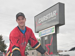 Marius Subocz washes a car on Saturday during the 10th annual Soaps It Up car wash at Carstar on Copernicus Boulevard.  Carstar locations across Canada held car washes to raise money for the Cystic Fibrosis Foundation. (Brian Thompson, The Expositor)