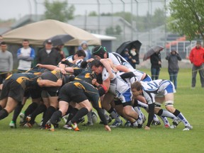 Leduc's LA Crude and the Fort McMurray Knights collide in a scrum during Saturday's game at the Westwood rugby pitch. TREVOR HOWLETT/TODAY STAFF