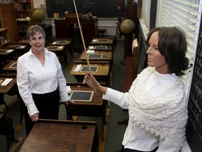 Volunteer Sue Mayka plays the role of teacher at the Frontenac County Schools Museum in Barriefield. (Ian MacAlpine The Whig-Standard)