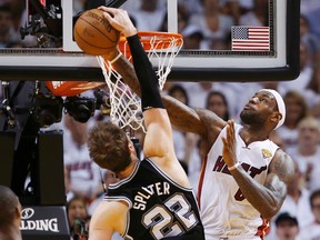Heat forward LeBron James blocks a shot by Spurs centre Tiago Splitter during Game 2 of the NBA Finals at American Airlines Arena in Miami, June 9, 2013. (MIKE SEGAR/Reuters)