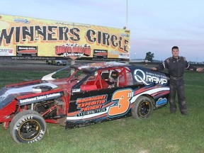 Matt Sorrell of Dresden celebrates his Mini-Mod feature win Saturday at South Buxton Raceway. (JAMES MACDONALD/Special to The Daily News)