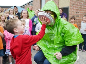 Pictured is Mrs. Doherty getting a pie in the face by 6-year-old Liam Doherty.