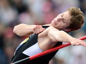 Corunna's Derek Drouin has been named Big Ten Athlete of the Year after winning his seventh overall Big Ten high jump title and his fourth outdoors title. He's pictured here last July at the 2012 Diamond League athletics meet at Crystal Palace in London, England, where he won with a jump of 2.26. AFP PHOTO/ADRIAN DENNIS