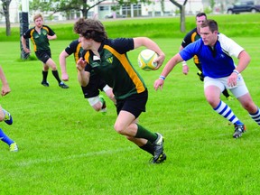 The Grande Prairie Centaurs Cory Winn looks for a lane up the sidelines after getting way from an Edmonton Pirate tackle in Edmonton Rugby Union play at Peace Wapiti Academy field  Saturday. The Centaurs won 26-12. (Diana Rinne/Daily Herald-Tribune)