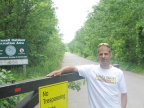 Adam Lauzon, head of the Cornwall Lunker Club, stands next to a gate that had prohibited access to the trout quarry for several weeks, postponing the club’s annual cleanup of the site.
Staff photo/CHERYL BRINK