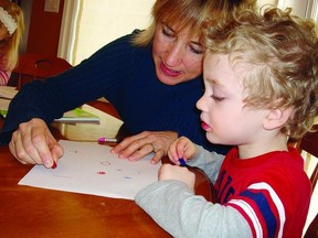 Marianne Hall, occupational therapist, works with junior kindergarten student Felix Wilson during one of her handwriting classes.       Contributed photo