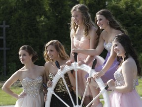 White Pines Grade 11 students Emili Quevillon, Taryn Ross, Katrina Brain, Amy Rudicki and Mackenzie Burden pose for a photo in Bellevue Park on Sunday on the way to the High School Prom. Three bus loads of students stopped off at the Park for photos before attending the Prom.