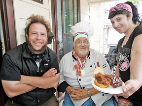 Stratford is going Hog Wild in June, with a number of food, culture and entertainment events focusing on pork. Here, Stratford Blues and Ribfest promoter Nathan McKay, chef Victor Iacobellis and roller derby girl Jennifer (J-Whoa) Zammit attend a launch event at Trench Marketing in Stratford Monday to highlight the upcoming festivities. (MIKE BEITZ, The Beacon Herald)