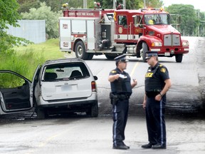 Quinte West OPP and Fire Department respond to a single vehicle collision on Stockdale Road in Quinte West June 11, 2013. A section of the road is closed to traffic and the detachment's crime unit is investigating. 
EMILY MOUNTNEY/TRENTONIAN/QMI AGENCY