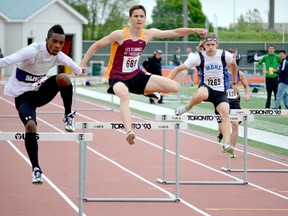 Philippe Johns, centre, of École secondaire catholique Thériault, competes in the midget boys 100-metre hurdles at the OFSAA Track & Field Championships in Oshawa on June 7. Johns set a personal best and a school record of 14.55, while finished in seventh place in the event. It was one of two Top 10 finishes at OFSAA for Johns.