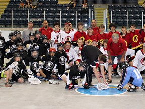 Longtime sponsor Randy Kitchen (centre) poses with players at Brantford Minor Lacrosse Association's new home at the Wayne Gretzky Sports Centre. (Submitted Photo)