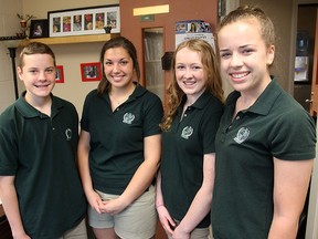 Adam Flisikowski, Cassandra Cantarutti, Olivia Lynch and Lexa Mahoney are Grade 9 students at Holy Cross Catholic Secondary School who have already completed the 40 hours of volunteer service to the community they are required to do by the time they graduate Grade 12. (Michael Lea The Whig-Standard)