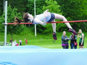 Madi Annen, a Grade 8 student at South Huron District High School, clears the bar in the senior girls division high jump Tuesday during the Avon Maitland South Region track and field meet at the Central flats in Stratford. (MIKE BEITZ, The Beacon Herald)