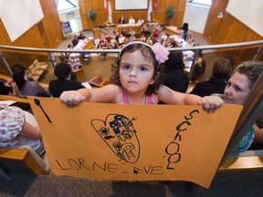 Four-year-old Sienna Caro attended the Thames Valley District school board meeting to show support for Lorne Ave. public school where she attends junior kindergarten. Sienna and her mother, Casandra Whiteside, helped to fill the public gallery to capacity. (DEREK RUTTAN, The London Free Press)