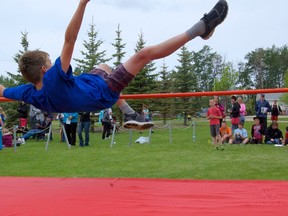 A student from E.E. Oliver clears the bar during the 41st annual Peace River School Division West End Divisional on Friday, June 7. (Daniele Alcinii/Fairview Post)