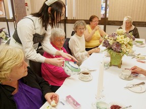 Seniors gather for a post-Edwardian afternoon tea in the theme of Downton Abbey at the Fairview Public Library on June 4. (Daniele Alcinii/Fairview Post)