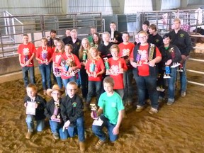 Local 4-H competitors and their trophies at the Interclub Show and Sale
