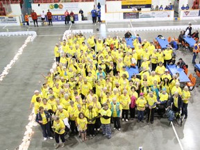 The survivors at Relay for Life gathered for a group picture after they walked a lap to start the event.